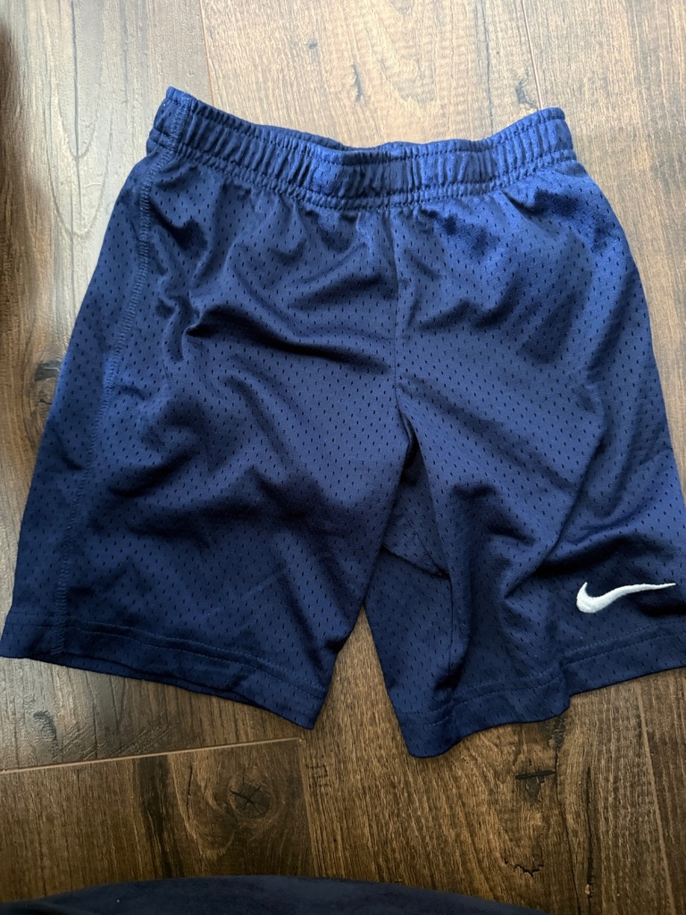 Nike kids Navy Athletic Mesh Shorts with White Swoosh - size 6-7